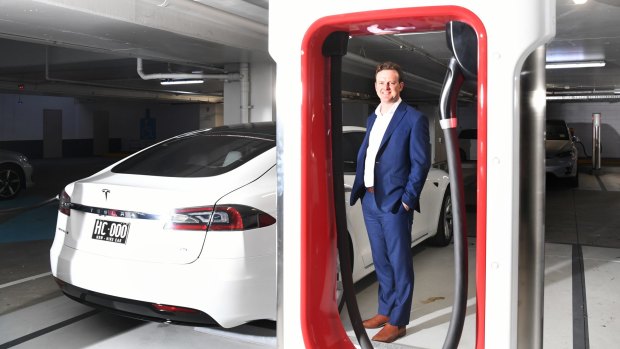 Tim Weale at one of Mirvac's electric car charge points in its Broadway Shopping Centre in Sydney.
