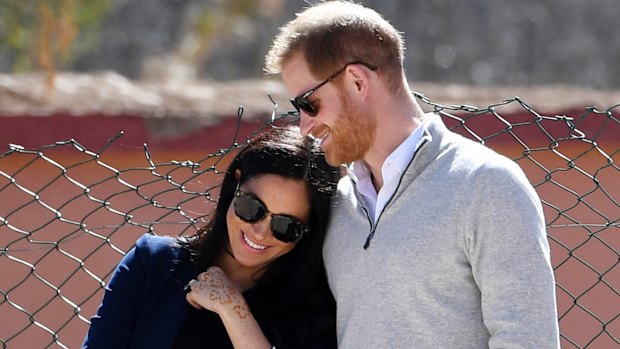 Prince Harry and Meghan, Duchess of Sussex, watch children playing football at a school in the town of Asni, in the Atlas mountains, Morocco, in February.