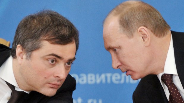 Russian Prime Minister Vladimir Putin, right, speaks to Vladislav Surkov, credited with converting Russian public life into a huge guessing game.