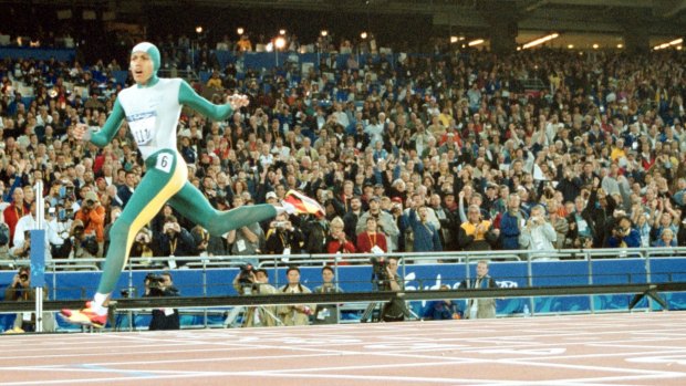 Cathy Freeman crosses the line to win gold at the Sydney 2000 Olympics.