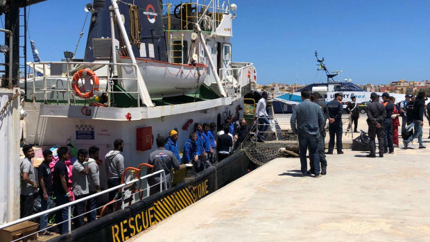Rescued migrants desembark from the Mare Jonio rescue ship of the Italian NGO Mediterranea Saving Humans as it docked at the port of the Italian island of Lampedusa, southern Italy.