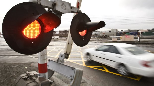 A funding dispute means there have been no rail level crossings replaced in south east Queensland since 2014.