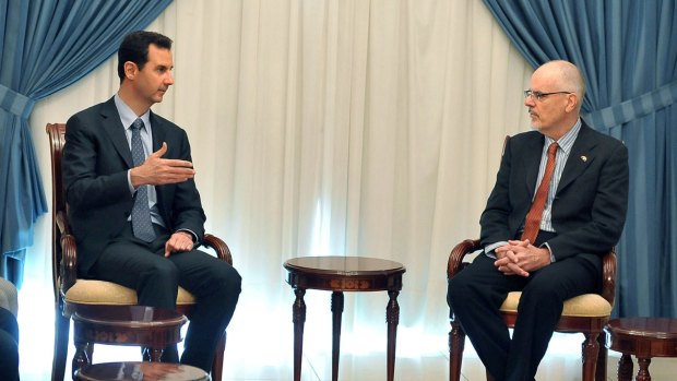 Syrian President Bashar al-Assad meets Australian academic Tim Anderson in Damascus, in a photo released by Syrian news agency SANA.