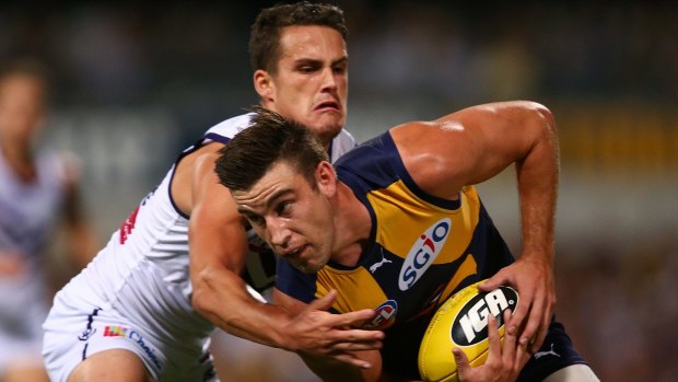 Eagles' Elliot Yeo looks to avoid being tackled by Dockers' Harley Balic during last year's round six derby. Both clubs are at loggerheads over the future of the Ross Glendinning Medal, after it was revealed this weekend's clash had no naming rights sponsor.