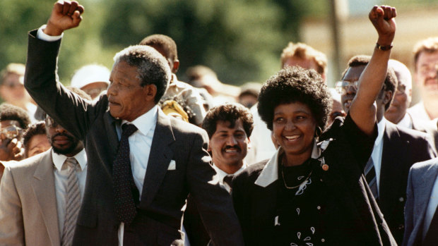 Nelson Mandela and Winnie raising their clenched fists upon his release from prison in 1990.