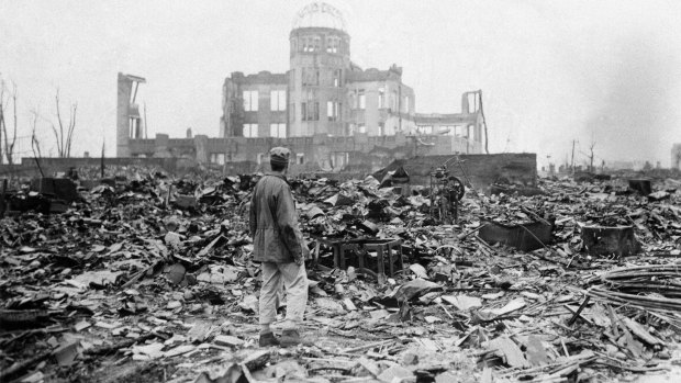 A man stands in the rubble surrounding a former movie theatre in Hiroshima after the atomic bomb was dropped in September 1945.