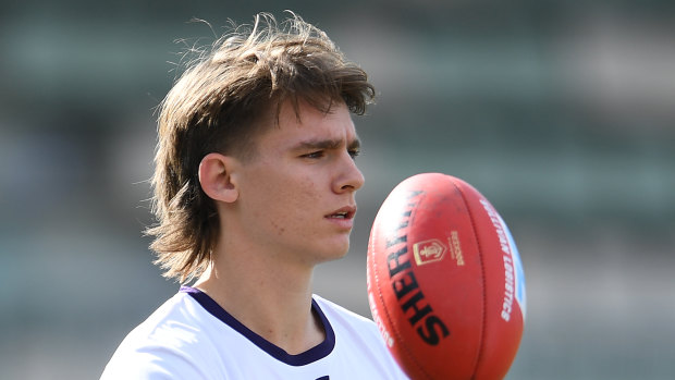 Caleb Serong, pictured during the warm up, looms as an important Dockers player today.