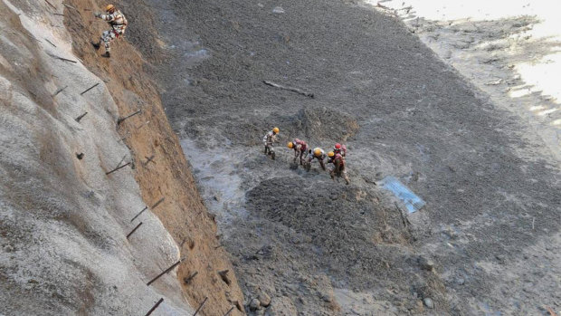 Officials said the glacier breaking sent water as well as mud and other debris surging down the mountain.