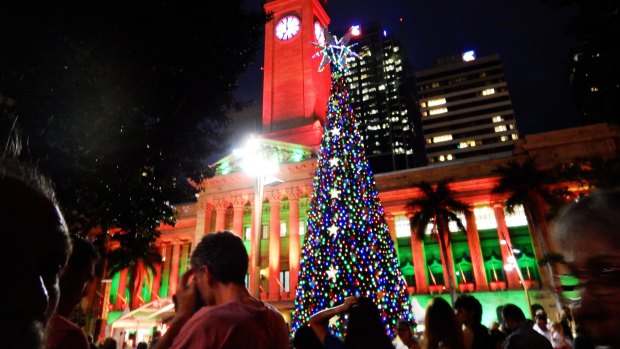 The lighting of the King George Square Christmas tree always draws a crowd.