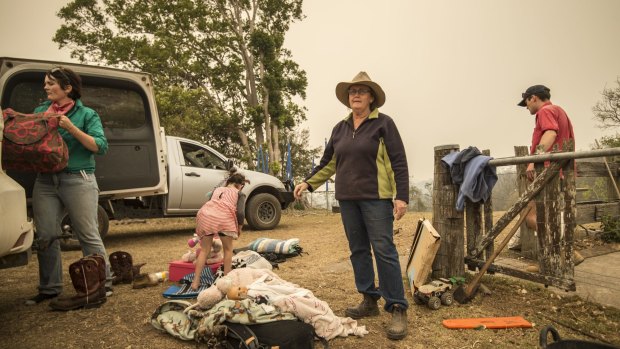 Dungay cattle farmers pack their vehicle ahead of worsening bushfire conditions tomorrow. 