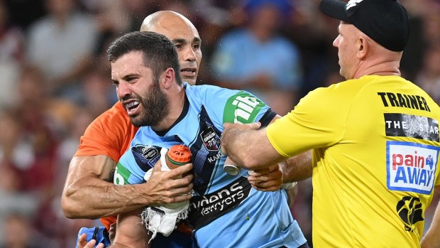 James Tedesco is helped from the field on Wednesday night.