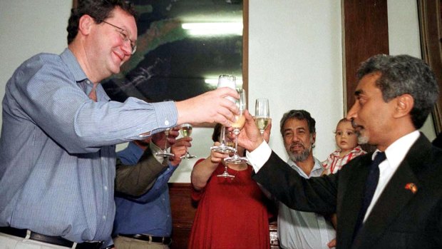 Before the storm: Alexander Downer toasts then economic affairs minister Mari Alkatiri in 2001 after signing a preliminary deal to split gas revenues from the Timor Sea.