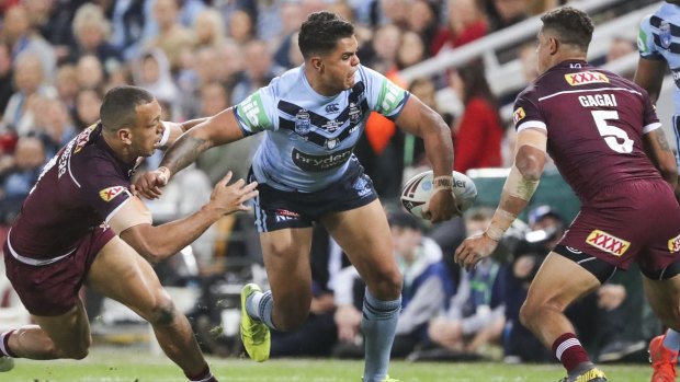 Not his day:  Latrell Mitchell of the Blues.