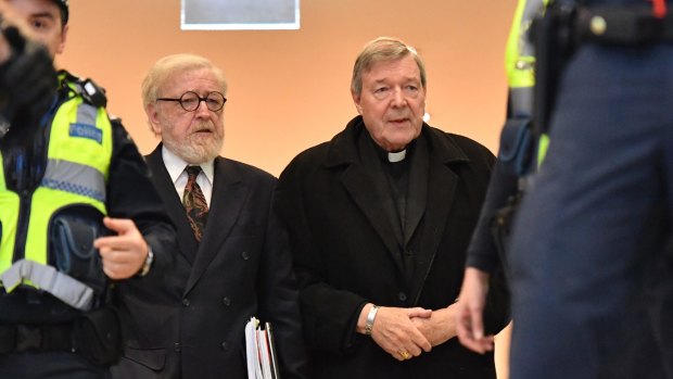 Robert Richter, QC, arrives at Melbourne Magistrates Court with George Pell in July 2017.