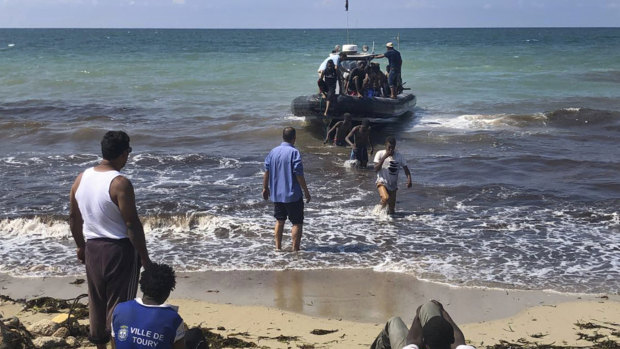 African migrants pulls in to shore east of Tripoli. According to the United Nations, the Libyan coast guard has intercepted or rescued more than 12,000 migrants in the Mediterranean as Europe's refugee crisis continues.