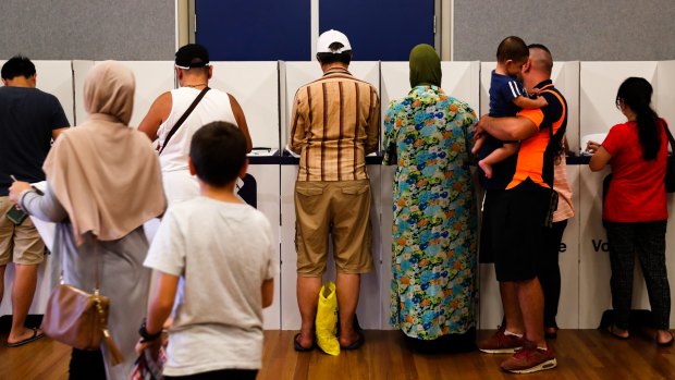 Voters at the Condell Park Public School polling booth in the East Hills electorate on Saturday. 