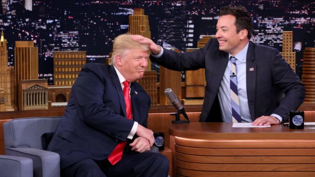 Jimmy Fallon ruffles Donald Trump's hair during an interview in September 2016.