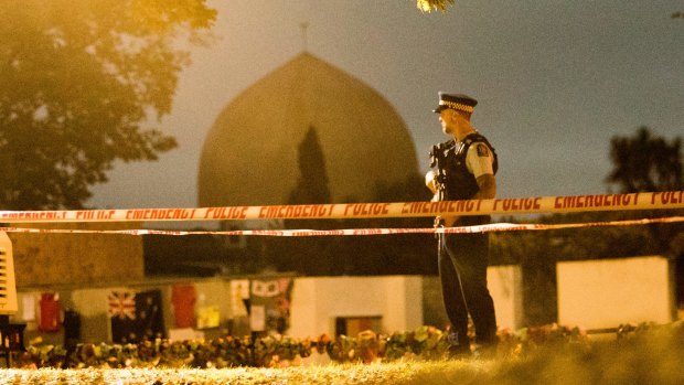 A policeman stands guard at the Al Noor Mosque ahead of a national call to prayer after the shootings.