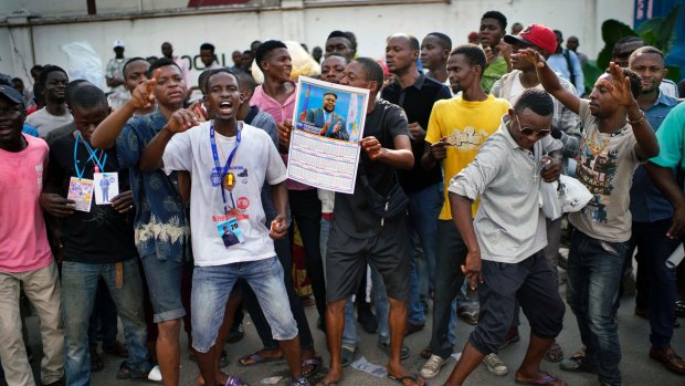 Supporters of Felix Tshisekedi outside the UDPS party headquarters in Kinshasa.