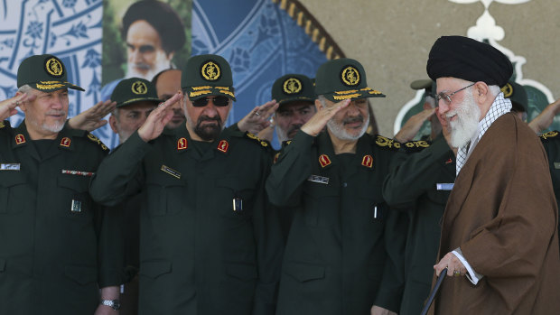 In this picture released by Iran, senior figures from the Revolutionary Guard salute Ayatollah Ali Khamenei.