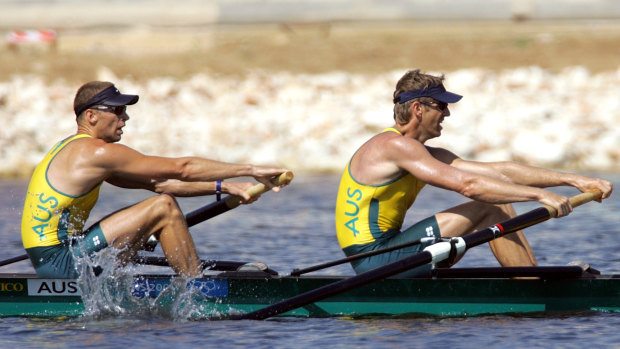 James Tomkins (right) with Drew Ginn rows in Athens towards a fourth Olympic gold medal.