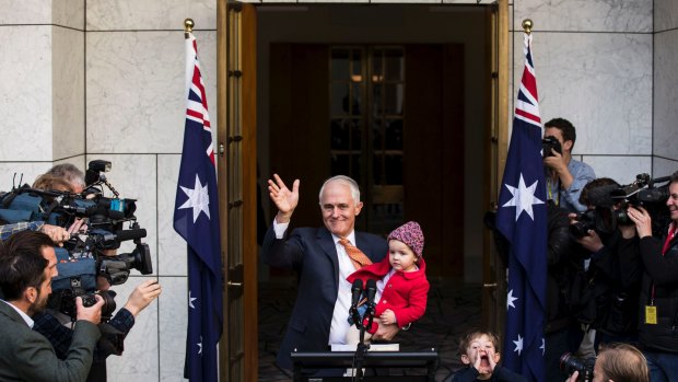 Outgoing prime minister Malcolm Turnbull with granddaughter Alice and grandson Jack after speaking to the media.