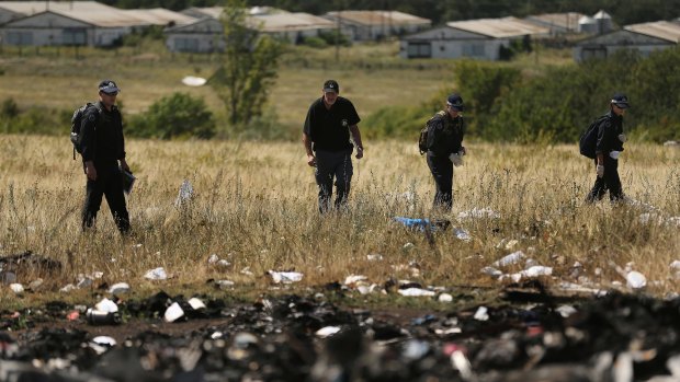 Australian Federal Police and their Dutch counterparts searching at the MH17 crash site for human remains in August 2014.