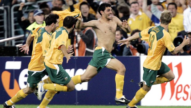 A shirtless John Aloisi celebrates scoring the penalty against Uruguay that put Australia into the 2006 World Cup.