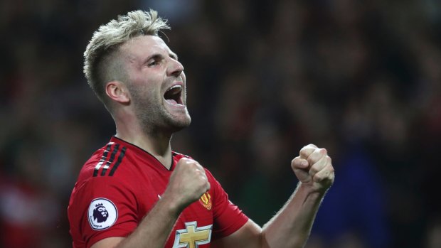 Manchester United's Luke Shaw celebrates after scoring his sides second goal of the game during the English Premier League soccer match between Manchester United and Leicester City at Old Trafford, in Manchester, England, Friday, Aug. 10, 2018. 