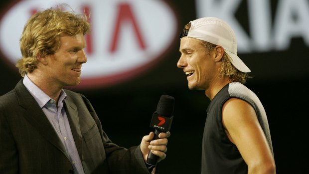 Jim Courier chats with Lleyton Hewitt on court at the 2005 Australian Open. Courier and Hewitt will share the commentary box again at this year’s Open.