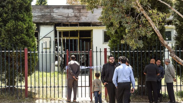 Community members outside the Imam Ali Islamic Centre in Fawkner after the December 2016 fire 
