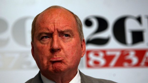 Broadcaster Alan Jones says he regrets using an 'old and offensive figure of speech'.