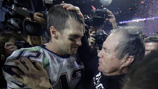 Winning formula: Patriots quarterback Tom Brady and Bill Belichick celebrate their Super Bowl win in 2015.