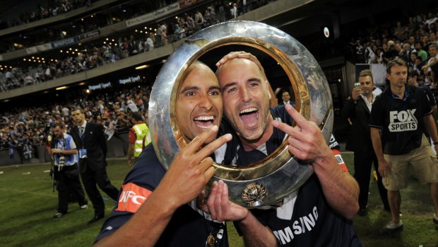 Archie Thompson and Kevin Muscat celebrate Victory's 2009 grand final success over Adelaide.








