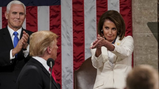 Donald Trump turns to Speaker Nancy Pelosi as he delivers his State of the Union address.