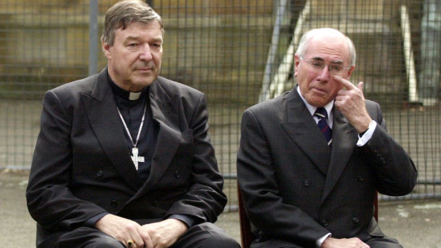 Cardinal George Pell and then prime minister John Howard at a media call at St Benedict's Church in August 2004.