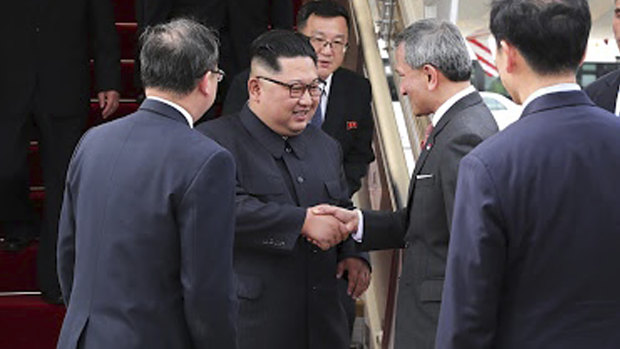 North Korean leader Kim Jong-un is greeted by Singapore Minister for Foreign Affairs Vivian Balakrishnan at Changi International Airport. 