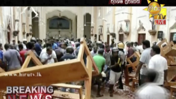 This image made from video provided by Hiru TV shows damage inside St Anthony's Shrine in Colombo.