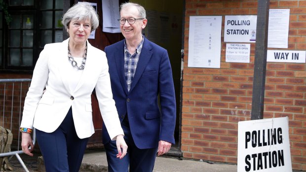 May leaves with her husband Philip after voting in the disastrous 2017 general election.