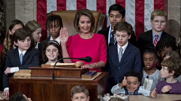 No stranger to children: US House Speaker Nancy Pelosi is sworn in while surrounded by children and grandchildren of representatives during a ceremony for the opening of the 116th Congress in the House Chamber in Washington, DC. 