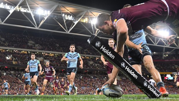 Logical replacement?: Corey Oates crosses in the corner to score a try in Queensland's Origin I win at Suncorp Stadium.
