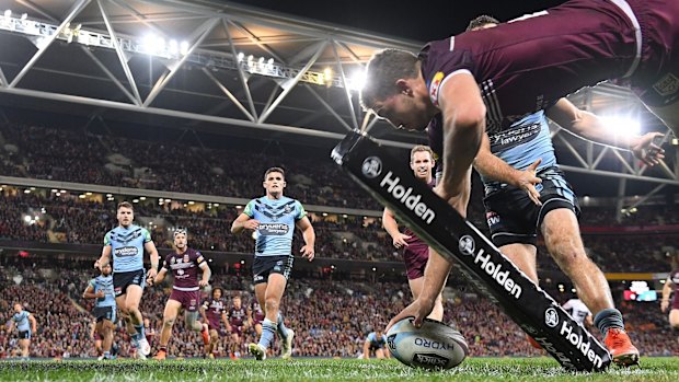 Logical replacement?: Corey Oates crosses in the corner to score a try in Queensland's Origin I win at Suncorp Stadium.