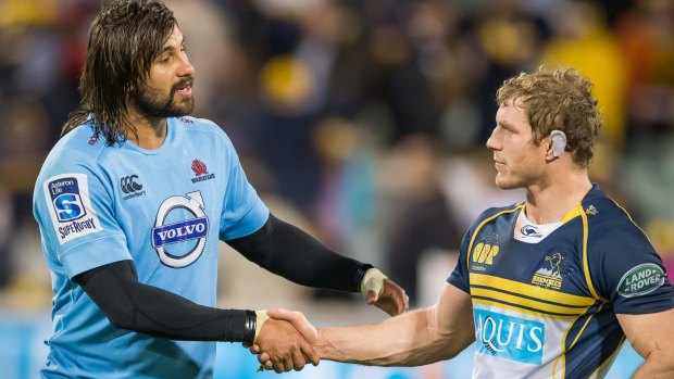 Creating change: David Pocock and Jacques Potgieter shake hands a year after Pocok called out the Waratahs player for a homophobic slur.