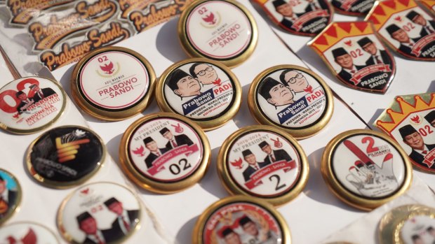 Buttons featuring images of presidential candidate Prabowo Subianto and his running mate Sandiaga Uno at a campaign rally in Karawang, West Java.