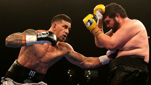 Sonny Bill Williams throws a left at Chauncy Welliver during their heavyweight bout in 2015.