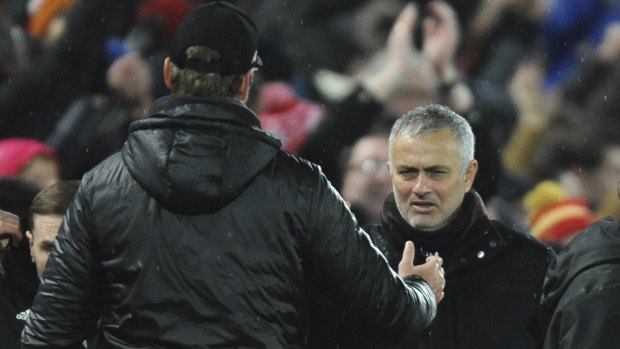 Different directions: Liverpool manager Juergen Klopp and Mourinho shake hands after the Reds' victory.