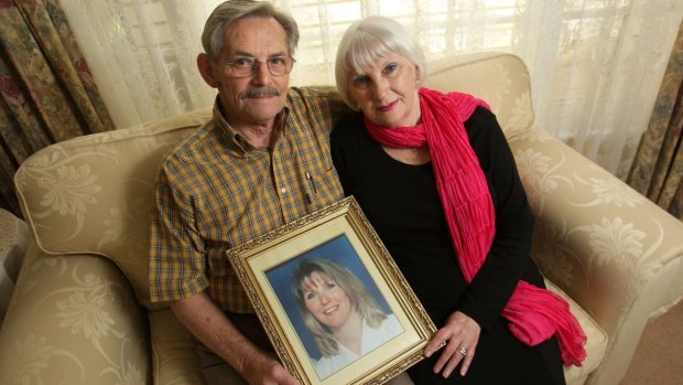 John and Helen Magill with a picture of their daughter Jane Thurgood-Dove, who was killed in 1997. 