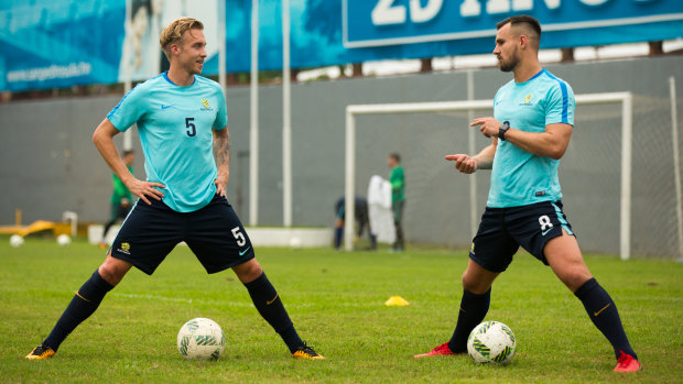Hands off: Fringe Socceroo James Jeggo (left) in Honduras with Bailey Wright.