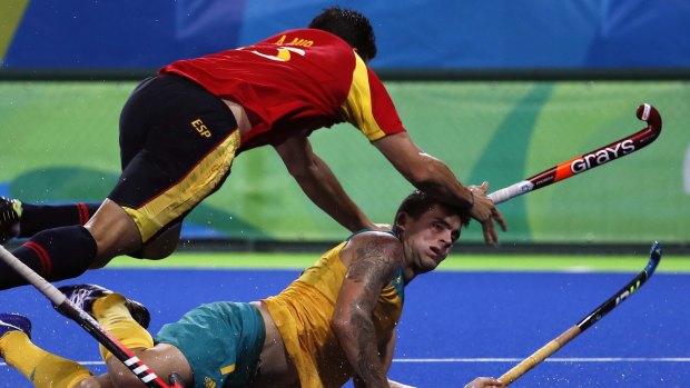 Spain's Andres Mir falls over Australia's Blake Govers during match at the 2016 Summer Olympics. 