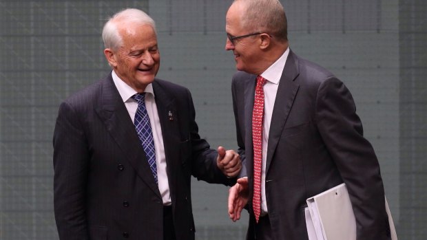Philip Ruddock, pictured here with Malcolm Turnbull in 2015, is pressuring Liberal electoral conferences to pick up their fundraising efforts.